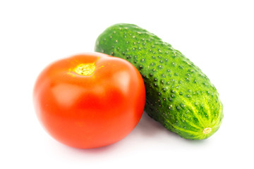 Tomato and cucumber isolated on white background.