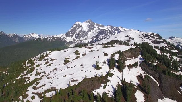 Summer Aerial View of Mt Shuksan Partially Covered in Snow