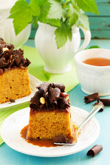 Caramel cake with chocolate decoration.
