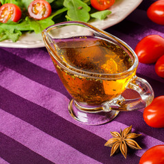Vegetable oil with herbs and spices in a saucepan.