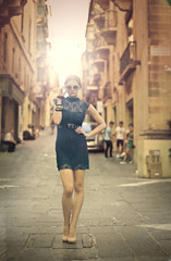 Fashionable woman standing in a street