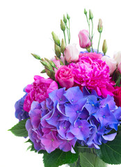 Bright pink peony, eustoma and blue hortensia flowers bouquet close up isolated on white background