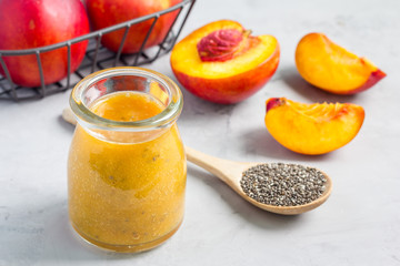 Smoothie with nectarine, orange juice, chia seeds and honey, horizontal