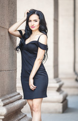 Beautiful woman in a sexy black dress