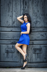 Beautiful woman in a sexy blue dress