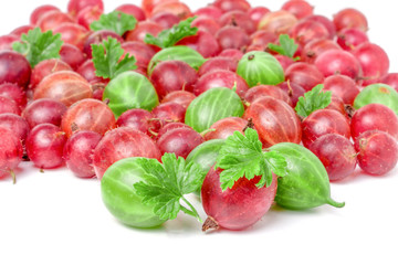 red and green gooseberries with leaves isolated on white background