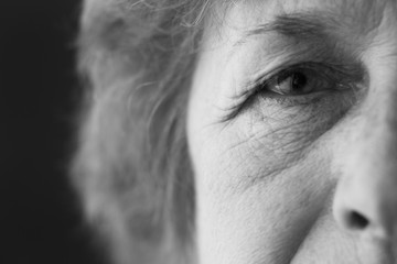 black and white photo of the face of an old woman