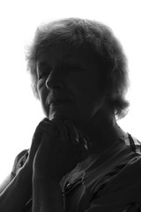 black and white silhouette of an old woman on an isolated background