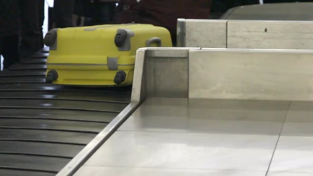 Luggage travels on a conveyor belt at the airport