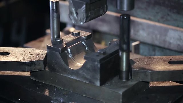 worker cleans the stamp and stamp detail