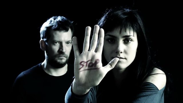 Concept of stop to violence on women with woman and man