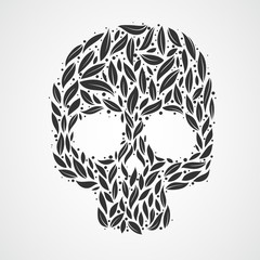 Abstract skull in leaves