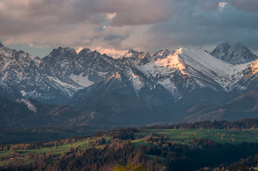 Obraz premium Cloudy Tatra mountains in the morning, covered with snow