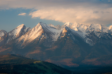 Obraz premium Cloudy Tatra mountains in the morning, covered with snow