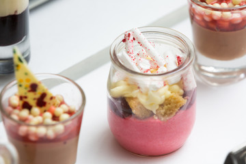rasberry parfait and chocolate mousse on the table