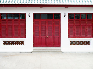 red door and windows traditional style of Thai temple