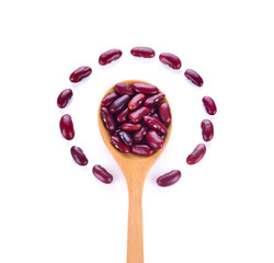 Red kidney beans on a wooden spoon isolate on white