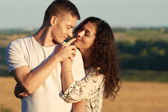 young couple posing high on country outdoor, romantic people love concept, summer season
