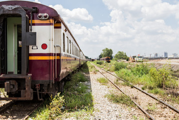 Fototapeta na wymiar Front view of trains on railways track parking in railroads platform 