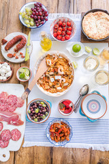 spanish food, paella and tapas on table