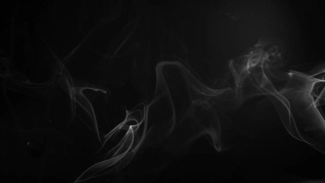Smoke fumes against a black background