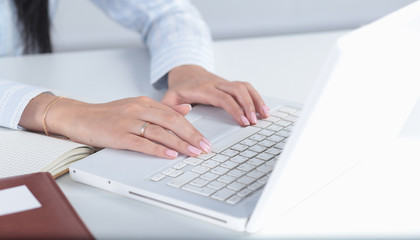 Female hands or woman office worker typing on the keyboard