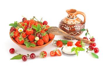 Strawberries with cream and ripe cherry.