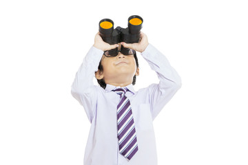 Boy looking through binocular
