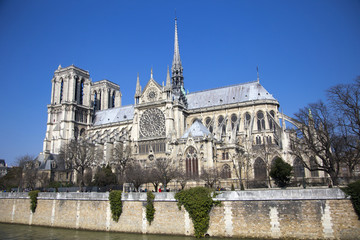 Fototapeta na wymiar Notre Dame cathedral next to Seine river in Paris, France
