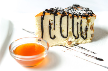 Cheese cake with chocolate sauce.