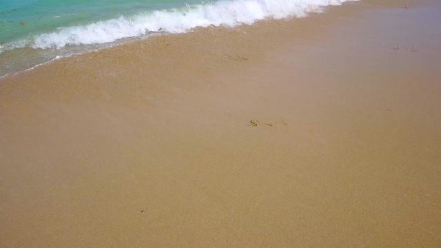 Sea waves wash shore on Bali