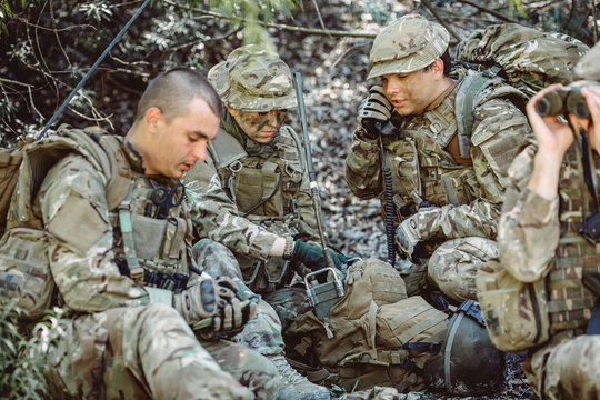 British Special Forces Soldiers With Weapon And Officer Holds A