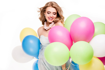 Fototapeta na wymiar Smiling pretty girl with balloons.