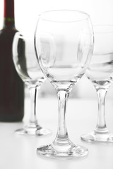 Wineglasses on blurred interior background