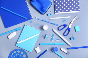 Set of stationery on grey table, top view