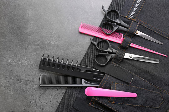 Professional hairdressing equipment in black case on grey background
