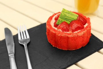 Strawberry biscuit cake on black slate plate