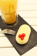 Dessert with red currant and juice on light wooden table