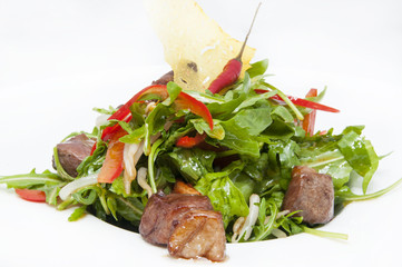 duck with arugula on a white background in the restaurant