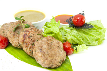 vegetarian meatballs with salad on a white background in restaurant