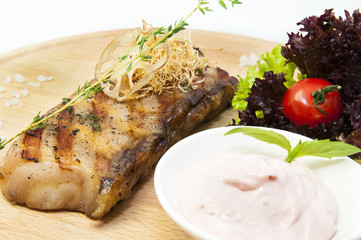 Catfish steak cooking on a grill in the restaurant