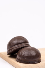 Chocolate round cookies with copy space on white background