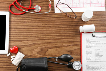 Medical concept. Medical manometer and a stethoscope on wooden background