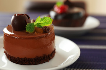 Caramel cake with tea on table