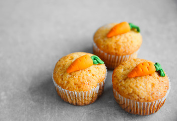 Carrot muffins on grey background
