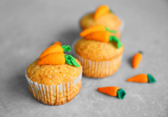 Carrot muffins on grey background