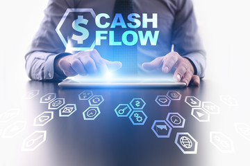 Businessman is using tablet pc and selecting Cash flow icon.