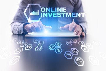 Businessman is using tablet pc and selecting Online investment icon.
