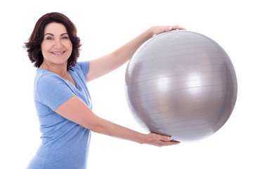portrait of sporty mature woman with fitness ball isolated on wh