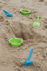 Child's toys on sandy beach, summer holidays concept